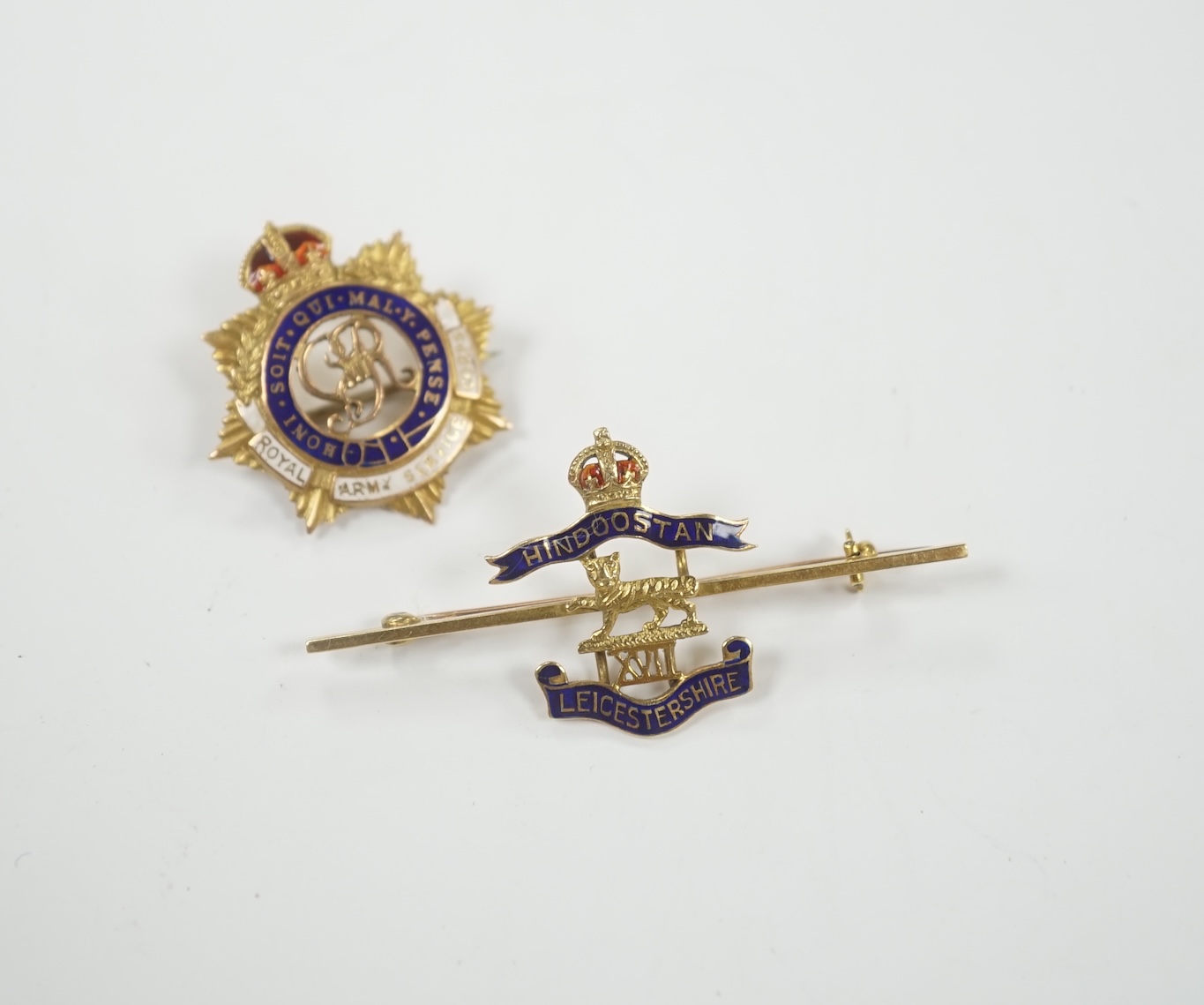 A 14ct and two colour enamel Royal Leicester Regiment sweethearts brooch, 50mm and a 9ct and enamel Royal Army Service Corps badge.